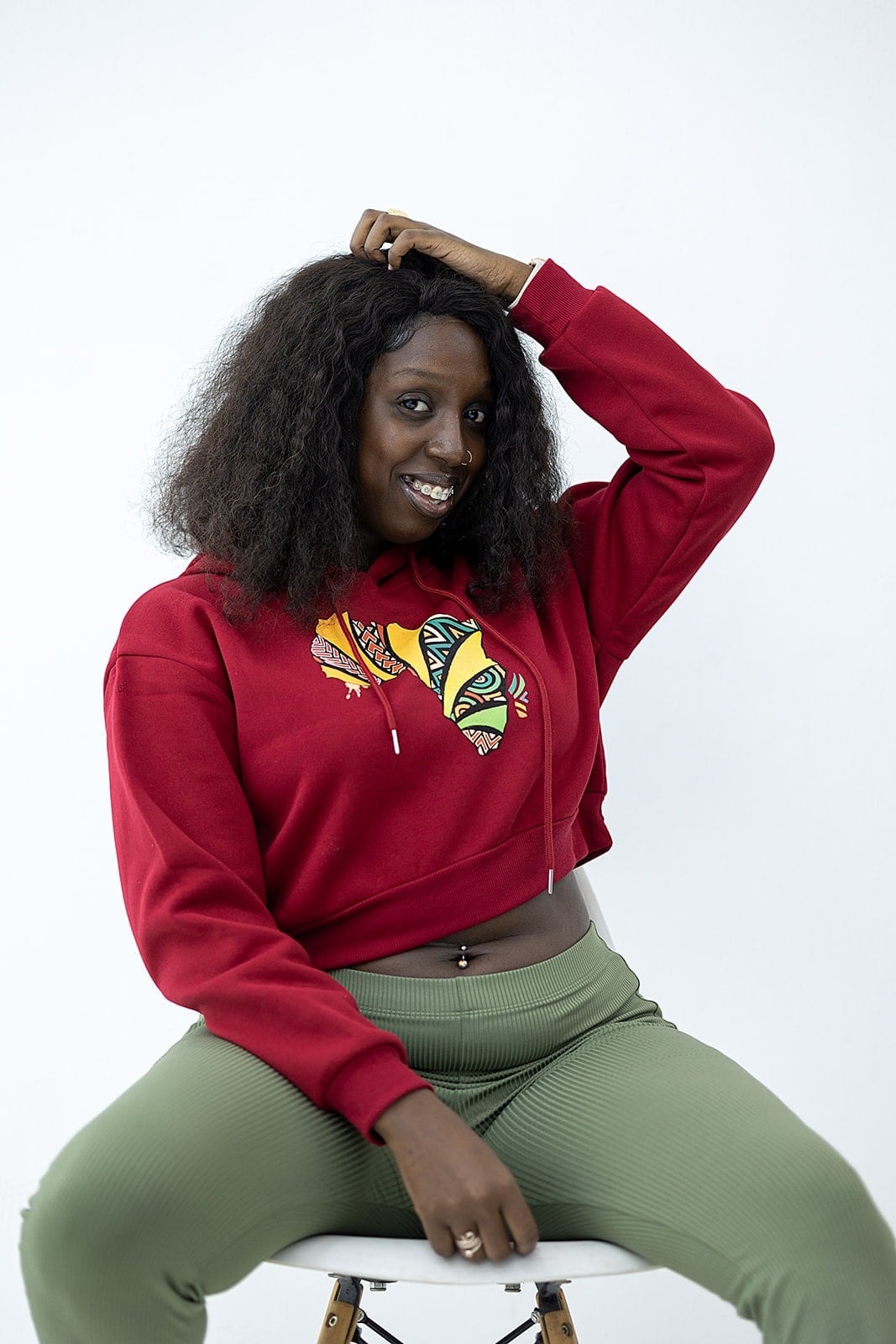 Model wearing a red Droop crop hoodie